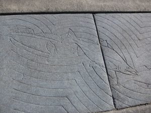 Fish design in sidewalk in Valdez