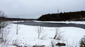 snow and open water on the Penobscot River at site of former dam