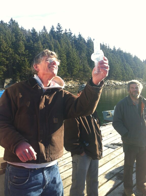 Photo of Chris holding a salinometer