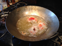 softshell green crabs frying in oil