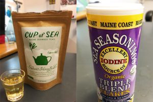 side-by-side images of a brown paper bag containing tea, and a shaker of seasoning flakes containing dulse, laver, and sea lettuce.