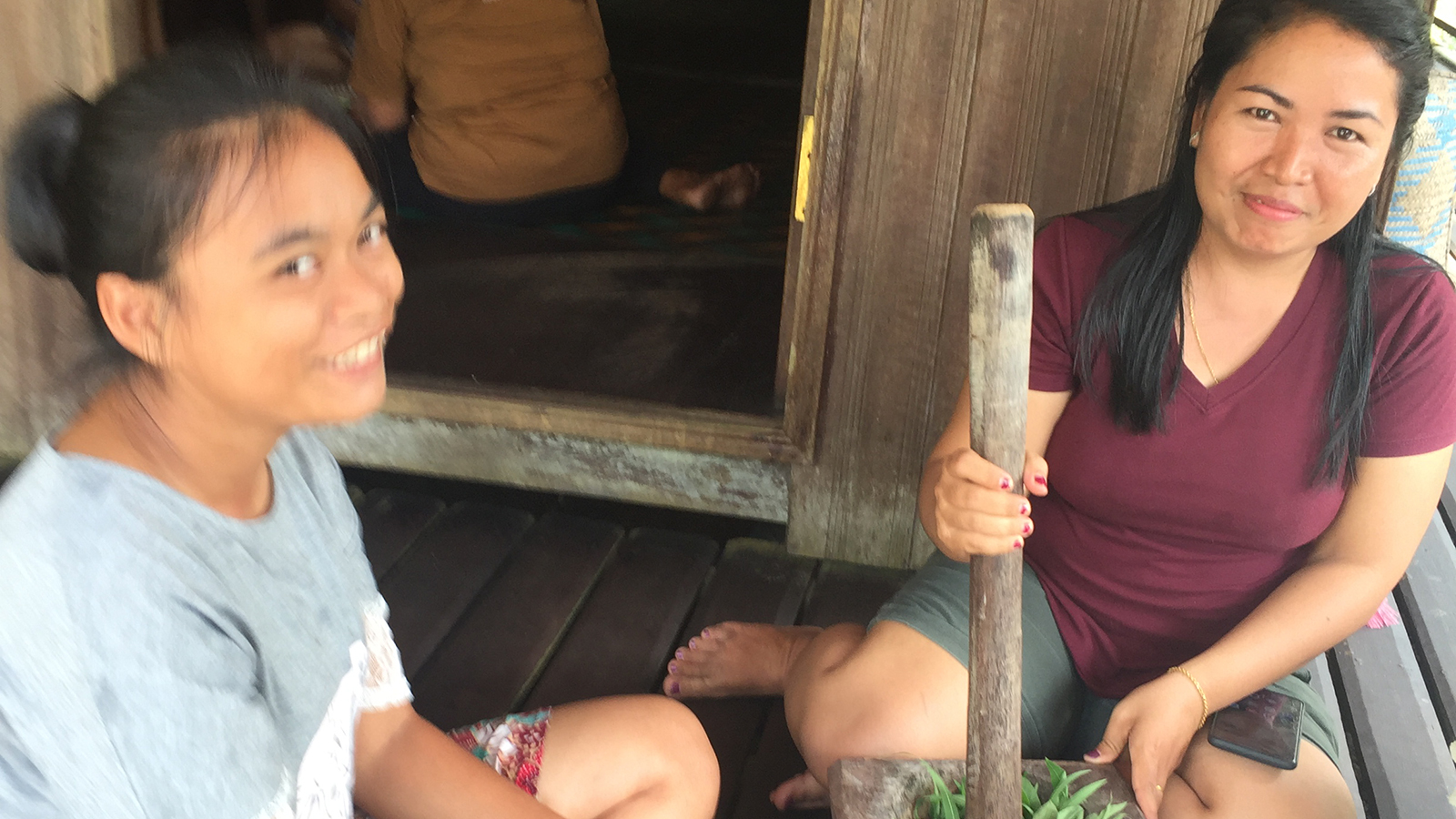 featured image two smiling women processing food