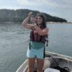 Hallie Arno standing in a boat