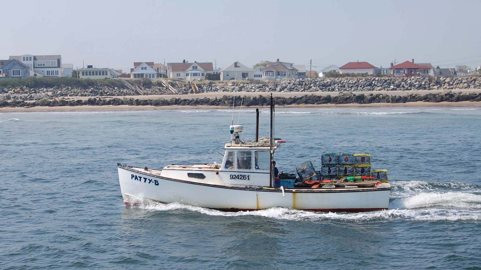 Lobster vessel with traps on the back