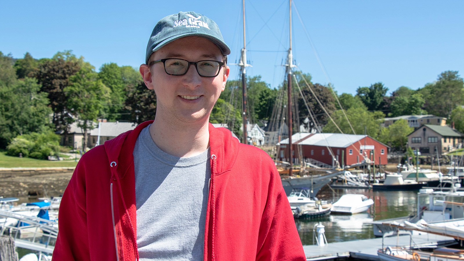 Bobby MacLeod standing in front of boats