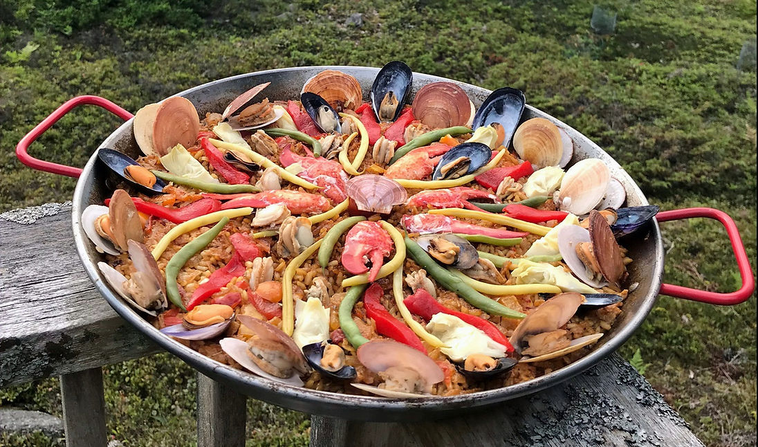 a wide dish of colorful paella