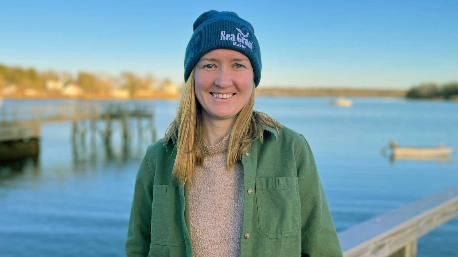 Maine Sea Grant's Annie Fagan smiles for the camera on a dock.