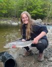 Smiling Gretchen Remlo holding a large fish