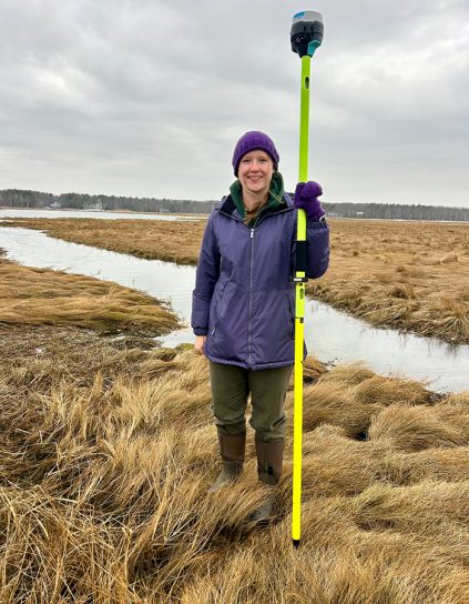 Katie Dewater standing in a marsh